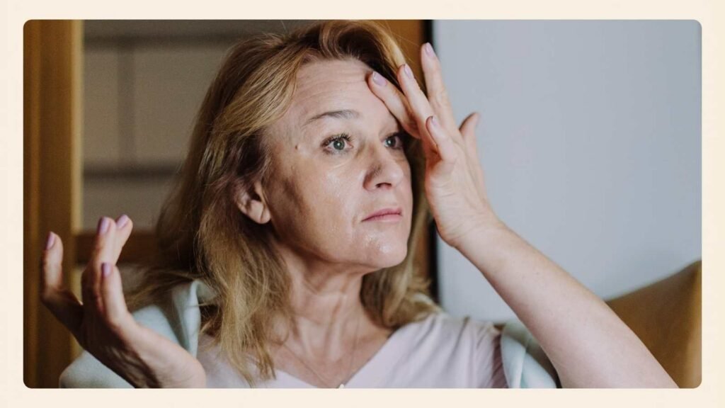 A mature woman in a warm editorial image representing intimacy and confidence