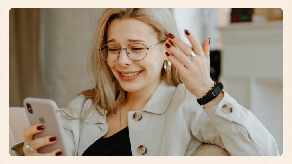 A thoughtful woman pausing with her phone while considering a relationship